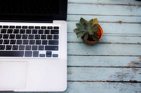 Top view copy space.desk table with laptop computer and flower.の写真素材