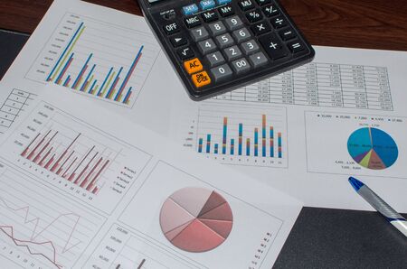 Business document Financial chart and graph and pen on desk.の写真素材