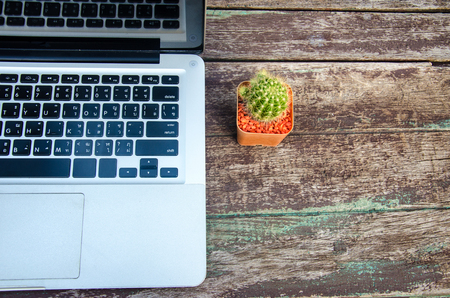 Top view copy space.desk table with laptop computer and flower.の写真素材