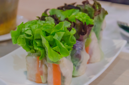 Salad roll vegetable wrap on dish.の写真素材