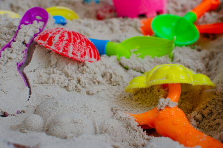 Children's toys on sand beach.の写真素材