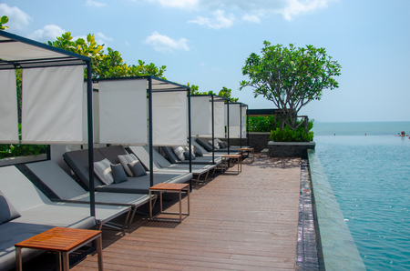 Beautiful luxury Chairs by the swimming pool in hotel.のeditorial素材