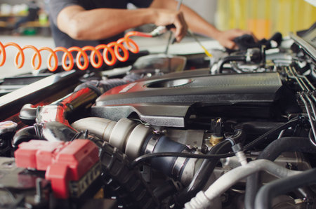 Man checking car engine