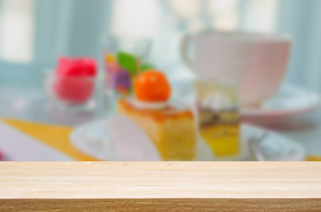 wood top table blur Cake cut into pieces on the table. Can be used for display or montage your...