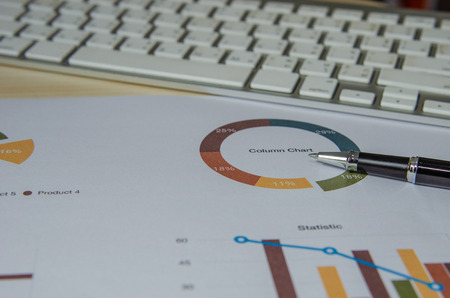 Business document Financial chart and graph and pen with keyboard.の写真素材