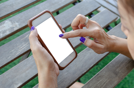 woman holding smart phone with blank desktop screen.の写真素材
