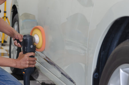 Man working for polishing, coating cars.