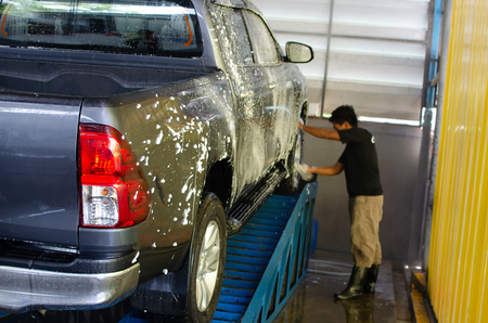 Blur cleaning people, car wash in car care shopの写真素材