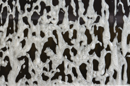 foam and soap on black background.の写真素材