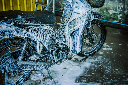 Wash motorcycle with foam.の写真素材