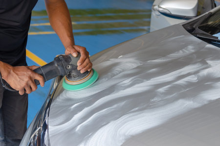 Man working for polishing, coating cars.