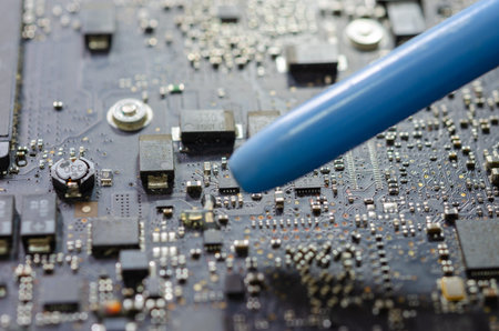 Blowing air to clean the notebook computer circuit board