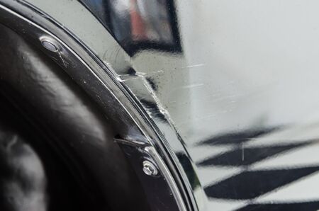 Scratches on the front of the black car.の写真素材