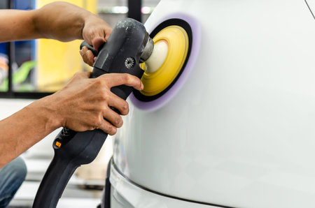 Man working for polishing, coating cars. polishing of the car will help eliminate contaminants on...
