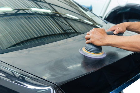 Man working for polishing, coating cars. polishing of the car will help eliminate contaminants on...