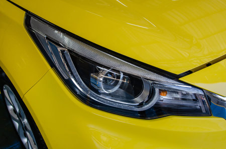 Modern details car yellow headlights.