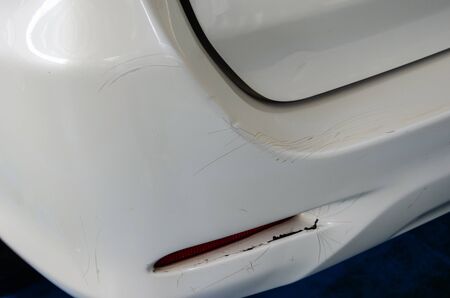 Cracks rear bumper white car.の写真素材