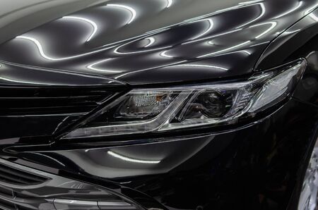 Black car with ceramic glass coating gives the car a shiny shine.の写真素材