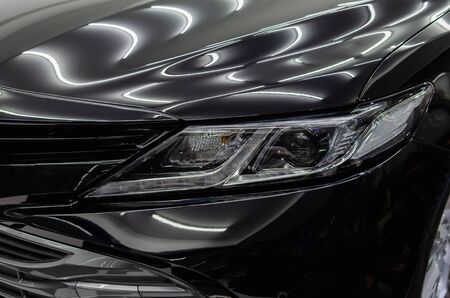 Black car with ceramic glass coating gives the car a shiny shine.