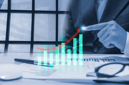 hands of businessman analyzing data graphs and charts of economic growth.business technology,...