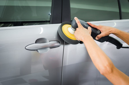 Man polishing the car surface