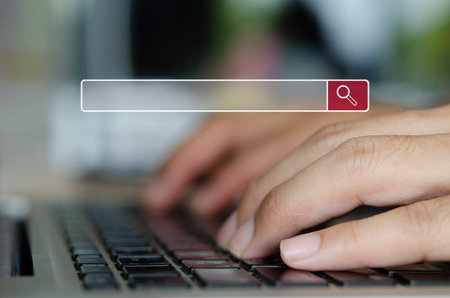 man hand is typing on a computer keyboard. Searching for information.Search the internet with an...