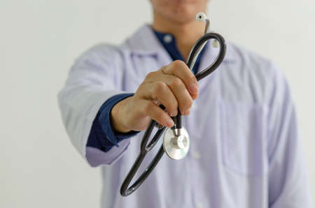 close up of the doctor hand holding a medical stethoscopeの写真素材