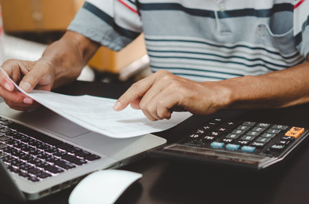 financial business documents tax marketing and computer keyboard and calculator on desk