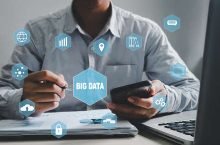 businessman holding tablet on hand and icon graph stock market virtual screen. Investment business and concept financeの写真素材