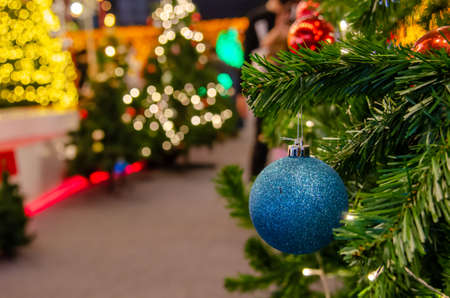 Blue balls decorated with Christmas tree decorations. New year and Christmas festivals. Copy space background.の写真素材
