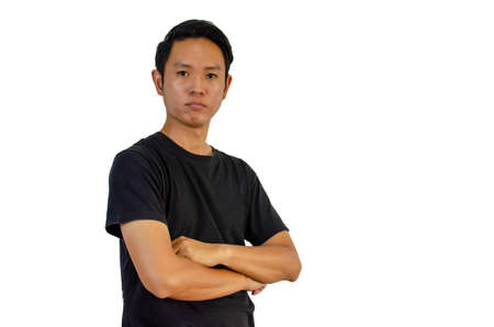 Asian man wearing a black T-shirt with his arms crossed on a white background.の写真素材