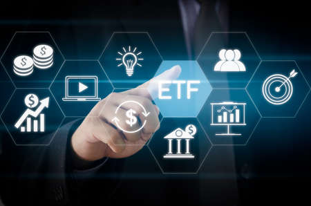 Hand businessman icon ETF Exchange Traded Fund virtual screen Internet Business stock market finance Index Fund Concept.の写真素材