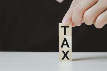 wooden cube block icon TAX business Concept.の写真素材