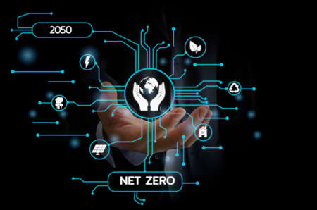 Businessman touching net zero save the eco world and reduce pollution virtual screen. virtual screen Business Technology Concept.の写真素材