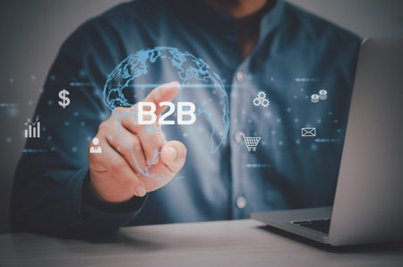man hand using laptop virtual screen B2B Business to Business icons and symbols. Business digital...