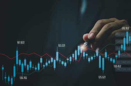Businessman hand forex trading financial stock market by graph and economic technology investment...