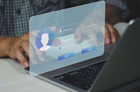 man using laptop computer and sign up or log in username password virtual touch screen.の写真素材