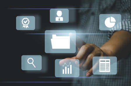 Businessman  touching on icons on virtual screen Enterprise Resource Planning ERP document management.Document Management System DMS concept.の写真素材