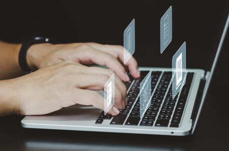 Man using laptop computer  document management and digital storage system screen virtual screen...