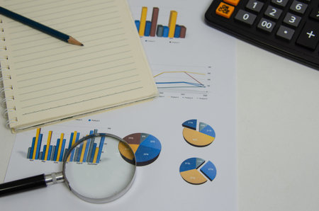 Document finance report paper datum graph diagram investment and pen magnifying glass.Business...