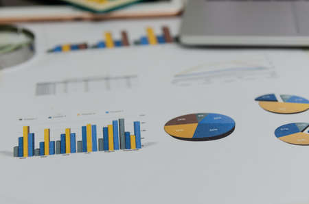 Business document chart report financial and graph statistic analysis management information and research investment plan sale on desk at office.の写真素材