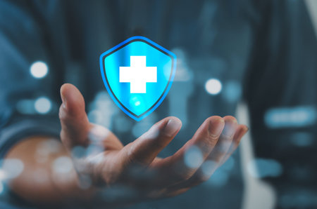 Man hand holding virtual medical health care icons with medical network connection.Business...