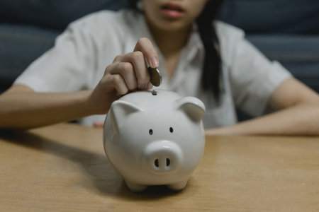 child asian finance economic investment wealth pig currency money business banking, cash success saving girl holding coin piggy bank.の写真素材