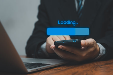 Man holding smart phone virtual screen loading digital internet online connect information system technology concept.の写真素材