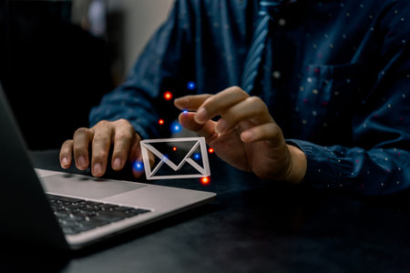 businessman using computer laptop and checking email icon 3D online or sending mail to partner and...