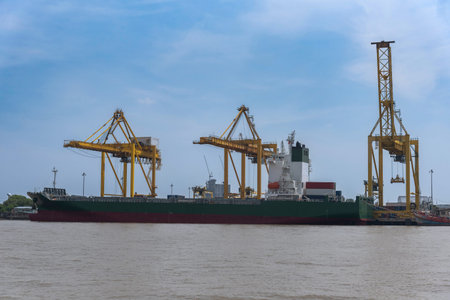 cargo port was hit by a large crane. The cargo ship docked at the port of import and export.