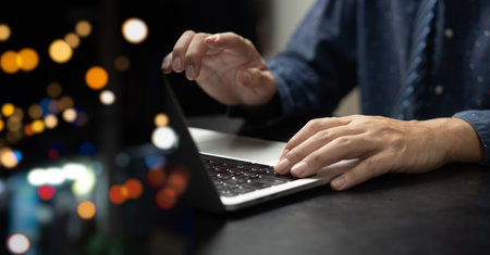 Businessman using laptop computer technology digital network working with bokeh.の写真素材