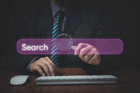 Man use computer to Searching for information.Search On Virtual Screen Data Search Technology Search Engine Optimization.Internet website online concept.の写真素材