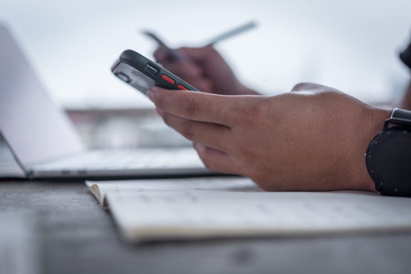 Man hands holding a credit card and using smart phone for online shopping.