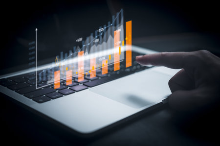Businessperson using laptop computer with chart. business investment and financial concept of growth...